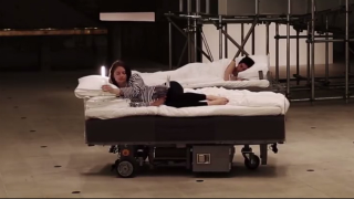 Illustration for article titled Roving Robotic Beds Are the Best Way To Commute While You Sleep